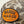 Close up of Marsh Wear Co patch on front of Camo hat with a beige background
