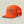 Front view of a bright orange baseball cap that says Marsh Wear outfitters on the front with a buck and has mesh back against a pale green background.