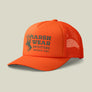 Front view of a bright orange baseball cap that says Marsh Wear outfitters on the front with a buck and has mesh back against a pale green background.