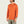 Man wearing an orange long-sleeve hoodie with a brand logo on a beige background