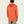 Person wearing an orange long sleeve with a hood against a blank background