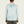 Light blue long sleeve worn by a person on a beige background