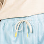 Up close view of frosty green shorts that have a drawstring