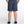 Person wearing navy shorts on a white background