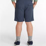 Person wearing navy shorts on a white background