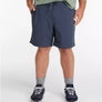 Person wearing navy shorts on a white background
