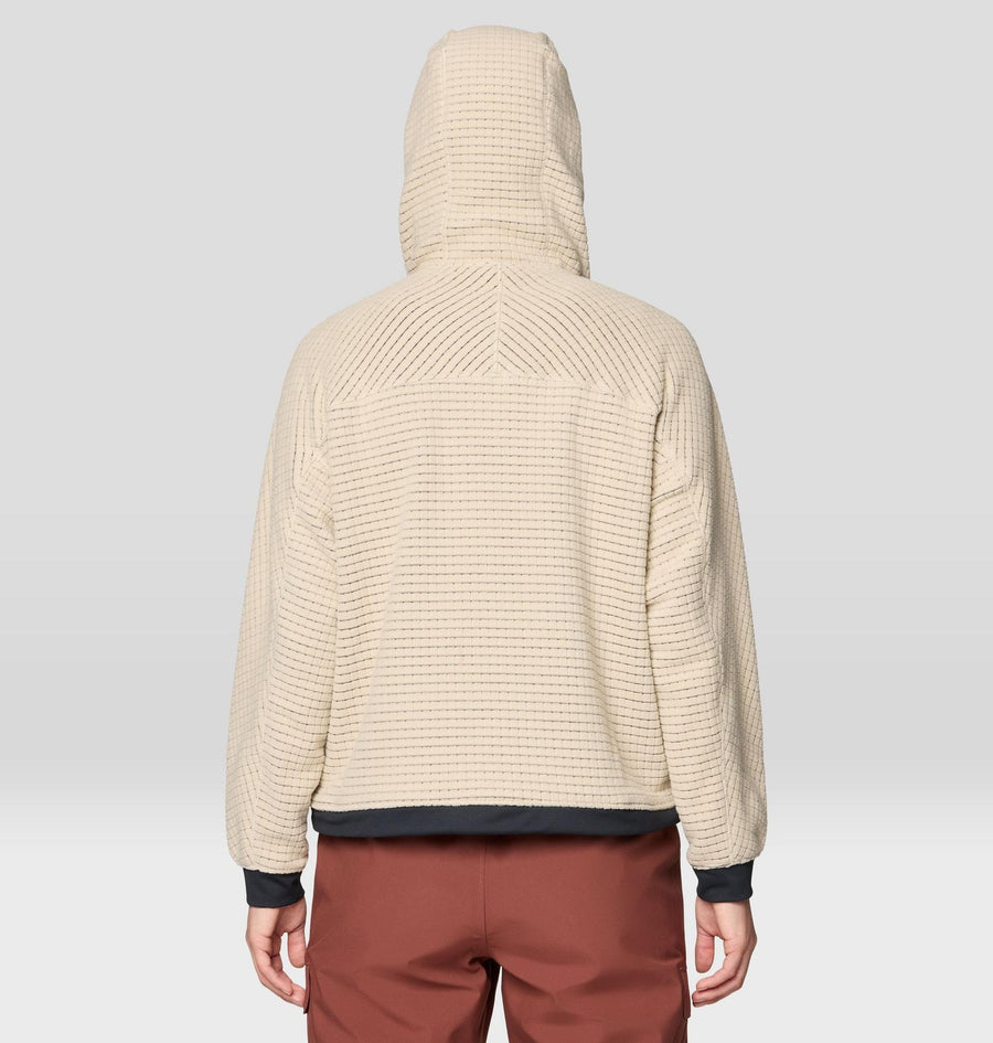 Beige hooded sweater worn by a person on a plain background
