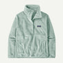 Light blue 1/2 button pull over fleece sweatshirt that has with the Patagonia logo on the front right part of the sweatshirt against a white background.
