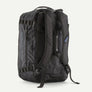 Back view of a duffel bag backpack with Patagonia in a light grey written on the side.