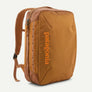 Burnt orange backpack with a brighter burnt orange Patagonia written on the front.