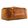 Burnt orange duffel bag with the Patagonia logo on the side in an orange color.