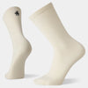 Pair of beige socks with a small logo on a white background