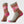 Pair of patterned socks with pink and brown design on a white background
