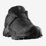 All black shoe with grey accents that have an S on the tongue of the shoe.