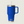Blue YETI mug with handle and straw on a light gray background