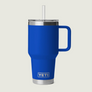 Blue YETI mug with handle and straw on a light gray background