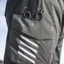 Close-up Simms Challenger Insulated bibs  with a pocket featuring a white stripe design.