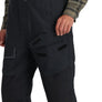 Black Simms Challenger Insulated bibs with multiple pockets worn by a person on a white background
