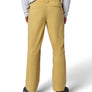 Person wearing mustard yellow pants on a white background