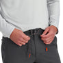 Person wearing gray pants with orange drawstrings on a white background