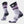 Socks with various shades of purple with a night sky on the upper leg part against a white background.