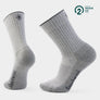 Light grey socks with Smartwool in dark grey on the side of the foot against a whtie background.