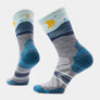 Light grey socks with various shades of blue accents and a night sky line that has a yellow moon.