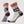 Pair of socks with nature-themed design on a white background