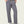 Person wearing dark grey sweatpants that has a tan and yellow draw string.
