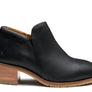 Black shoe with a wooden heel against a white background.