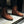 Person standing wearing brown boots.