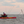 Person in a kayak using a ParkNPole in a kayak on water with a sunset in the background