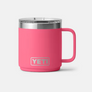 Small bright pink mug with silver accents  against a white background.