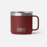 Dark red mug with yeti etched at the bottom of the mug against a white background.
