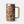 Mug that is brown camo and has stainless steel on the rim as well as for the Yeti logo on the bottom of the cup.