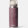 Bottle with a tan cap and a red and tan print on the main bottle part against a white background.