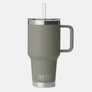 Pale dark green mug with a straw and Yeti etched at the base of the mug against a white background.
