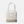 A Tote bag that is cream, beige and a light tan color with the Yeti logo on the front in same cream color as the handles of the bag.