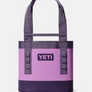 A light purple tote bag with dark purple accents with a Yeti logo on the front that is dark purple and light purple.