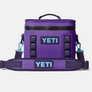 Purple Yeti zip up cooler with light blue strap hooks and light blue yeti color on the strap and front of the cooler.
