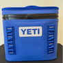 Royal blue zip up color with a yeti logo on the front of it.