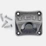 A metal wall mounted bottle opener that has a set of 4 screws next to the opener against a white background.